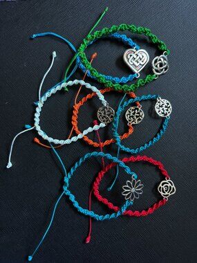 Lot of 7 Handmade Adjustable Braided Bracelets Silvertone Celtic & Floral Charms
